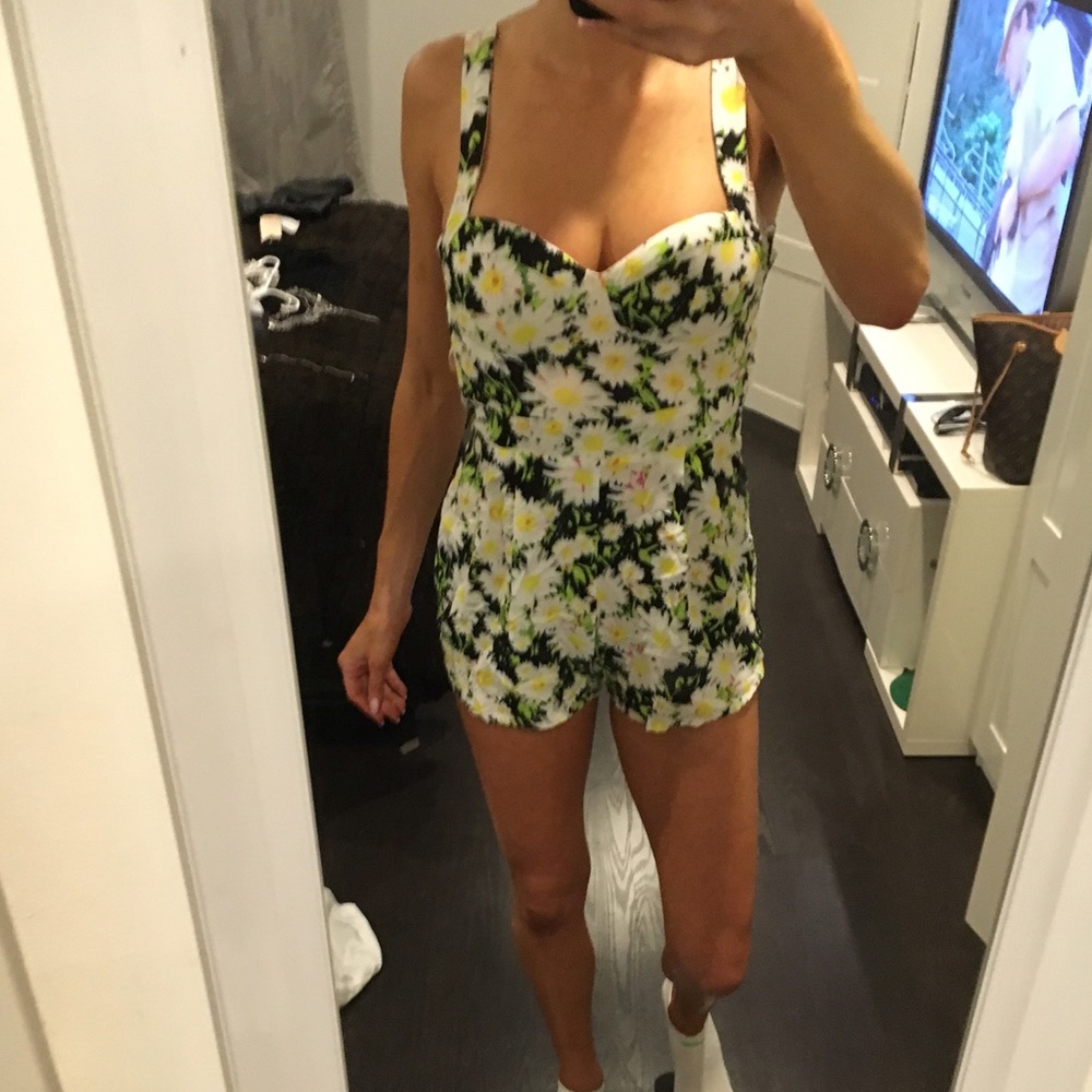 Sexy floral romper with open back bow.